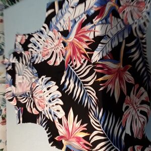 Tropical print sleeveless golf shirt